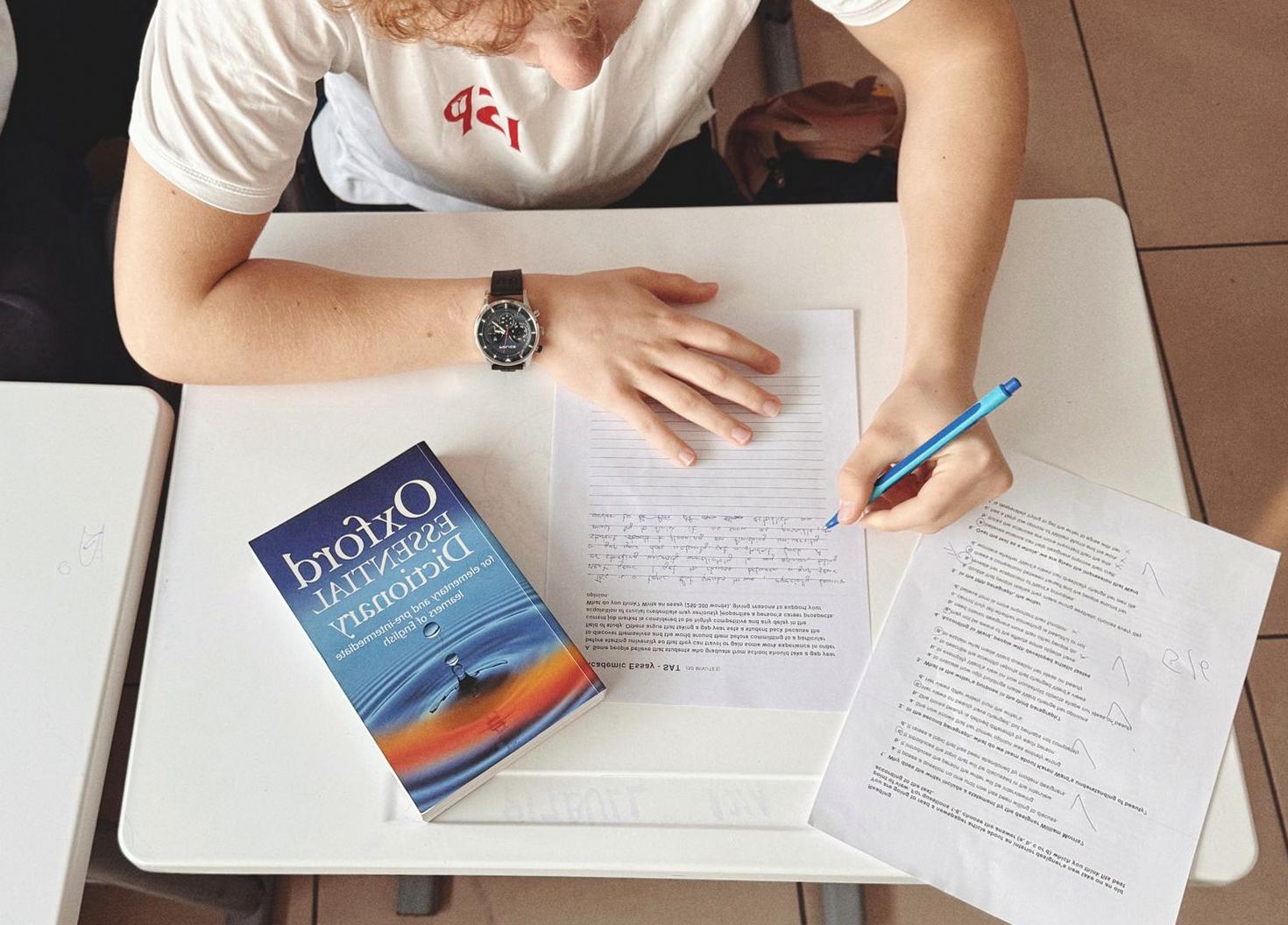 Student writing notes